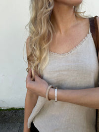 Amalthe -pellavapitsitoppi, sand